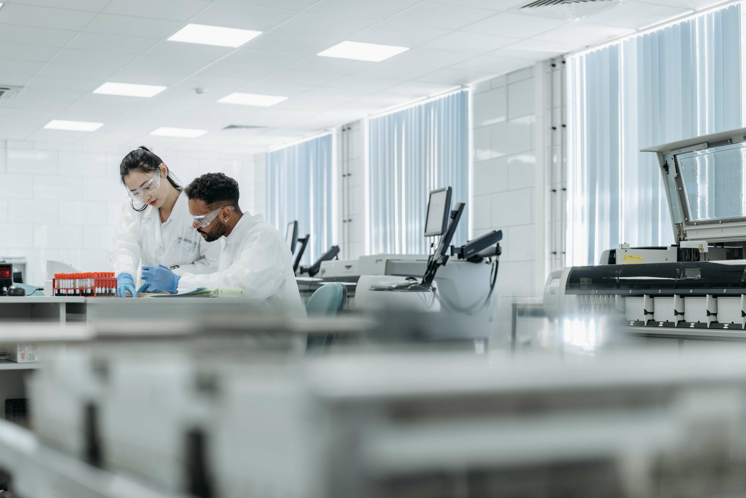 Two medical practitioners doing research on a lab