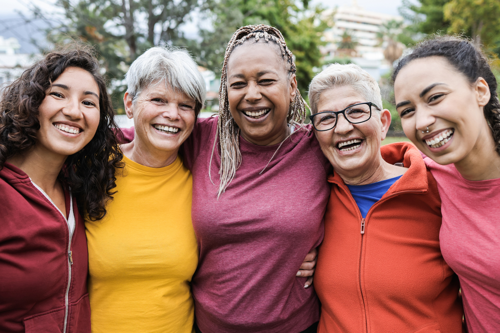 Happy multi generational women having fun together - Multiracial friends smiling on camera after sport workout outdoors